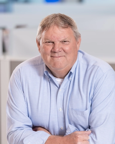 portrait of a smiling person in professional attire